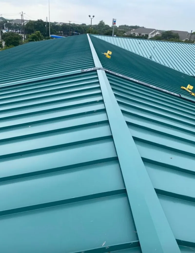 Green commercial metal roof ridge and valley for Metal Roof Repair in Estes Park